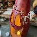 This shows the spooky detail of the pumpkin. It has scares across his face that have been stitched up with hemp cord. 